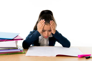little-schoolgirl-worried-in-stress-studying-for-exam-000047245362_Small